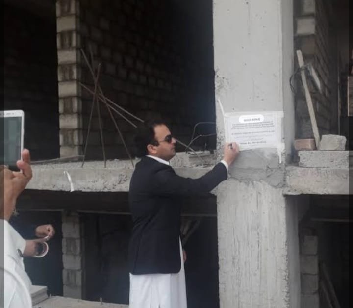 Commercial Plaza Under Construction Without Approved Building Plan Sealed in Peshawar Housing Scheme